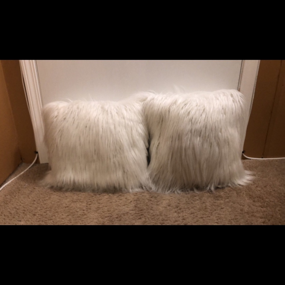 Two White Fuzzy Throw Pillows